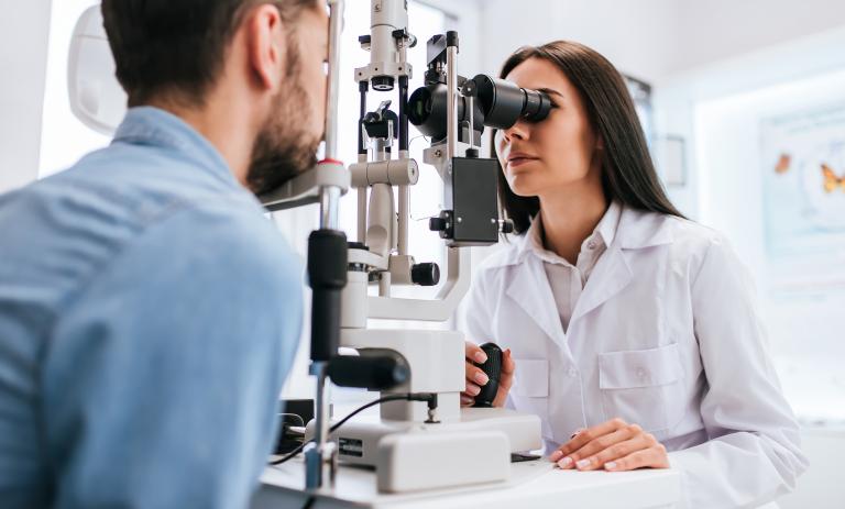 ophthalmologist checking the vision of a patient in a modern clinic.