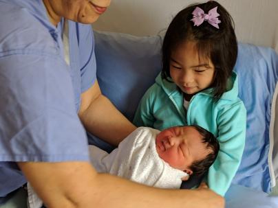 Steve's daughters at Richmond Hospital, Jamie holding new born baby Hanna.