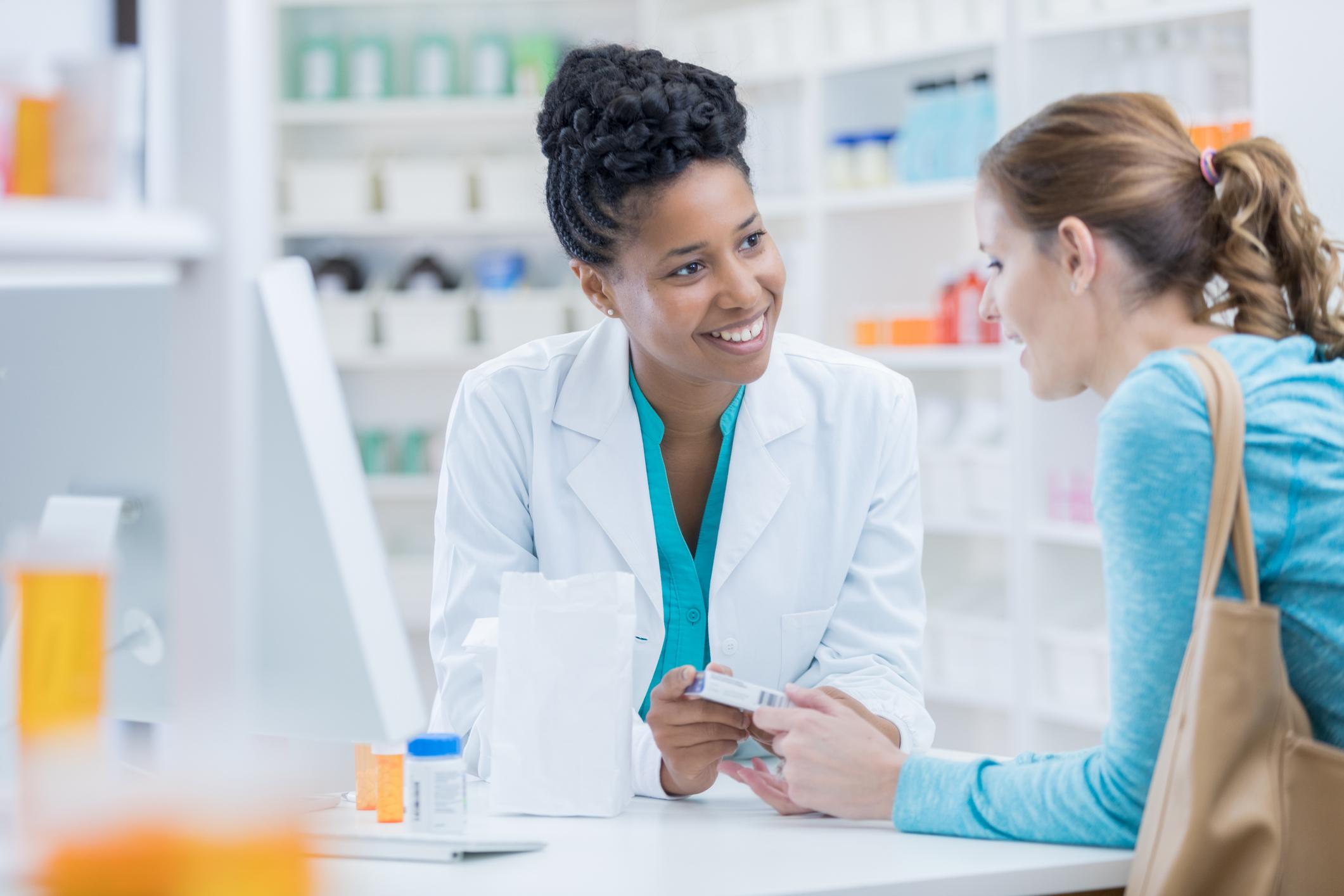 Pharmacy customer asksing a pharmacist a question