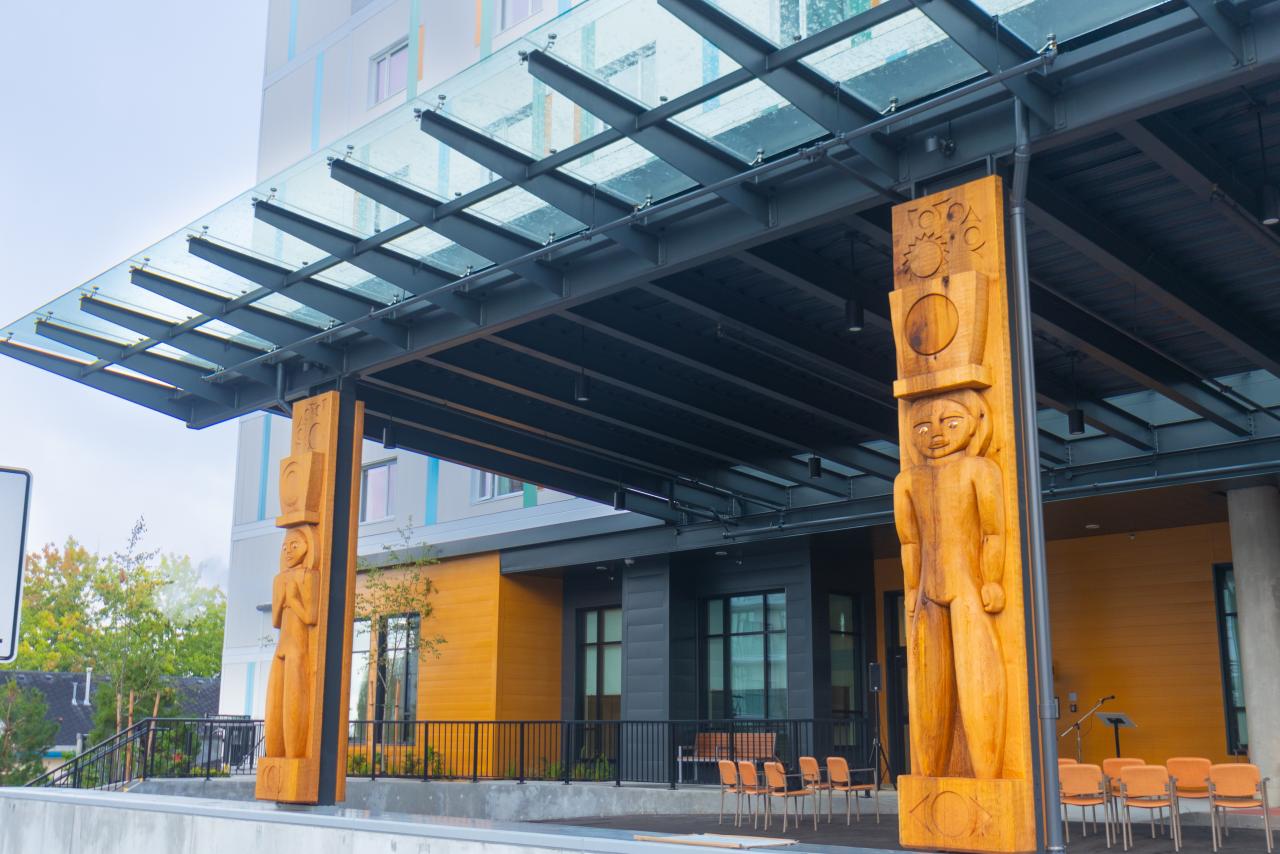 Female House Post and Male House Post at Dogwood care home by Thomas Cannell and Brent Sparrow