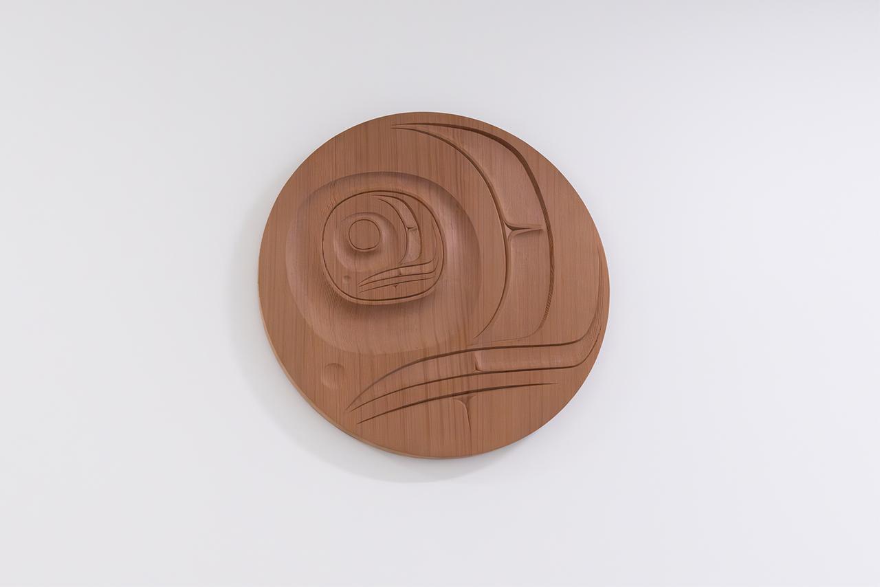 Indigenous wooden carving of a salmon 