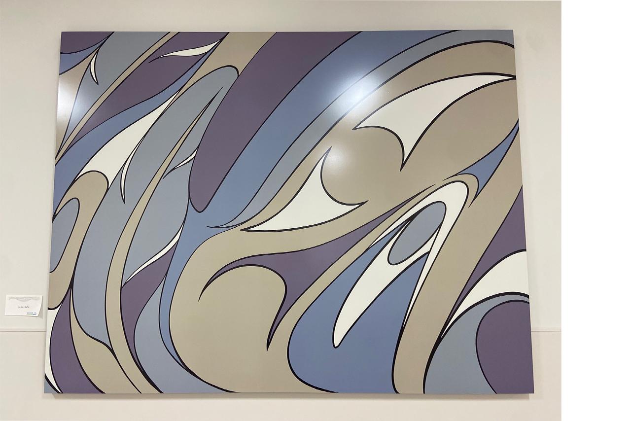 Indigenous painting on a wall in blues and grey