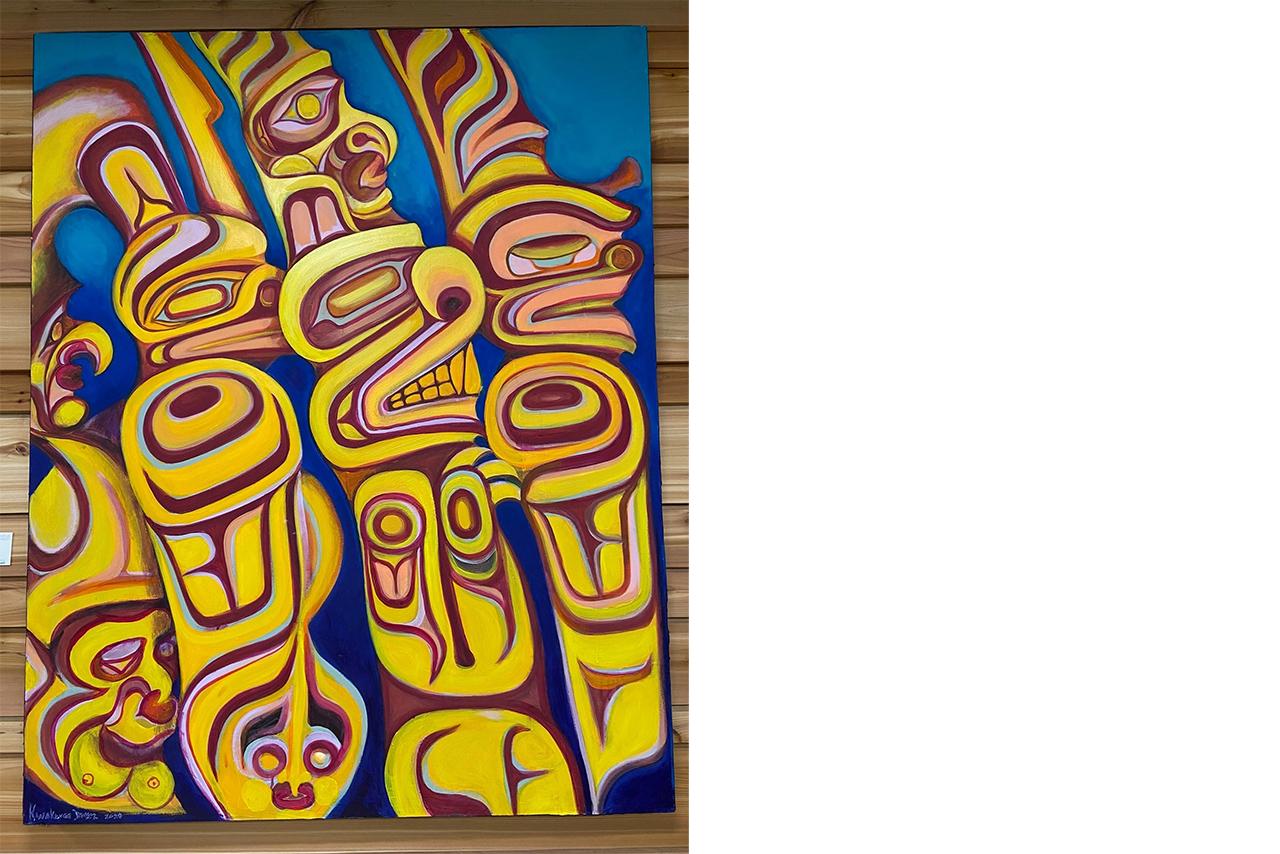 painting of indigenous artwork on a wooden wall