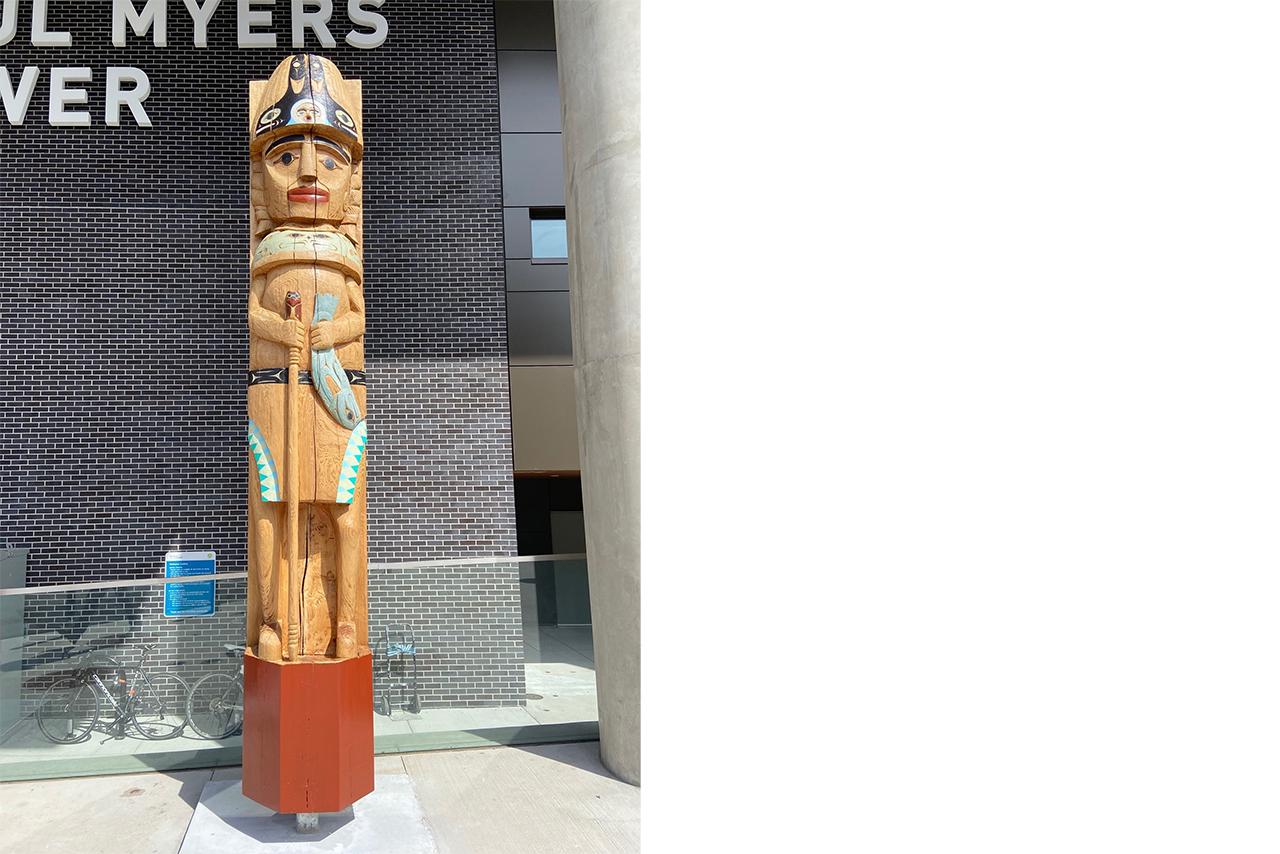 Welcome figure outside Paul Myers Tower hospital building