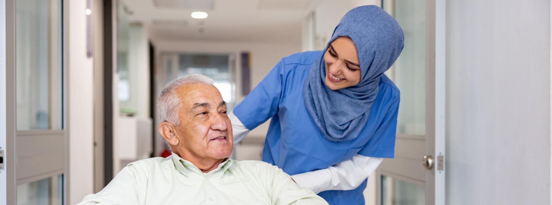 Nurse pushing a client in a wheelchair