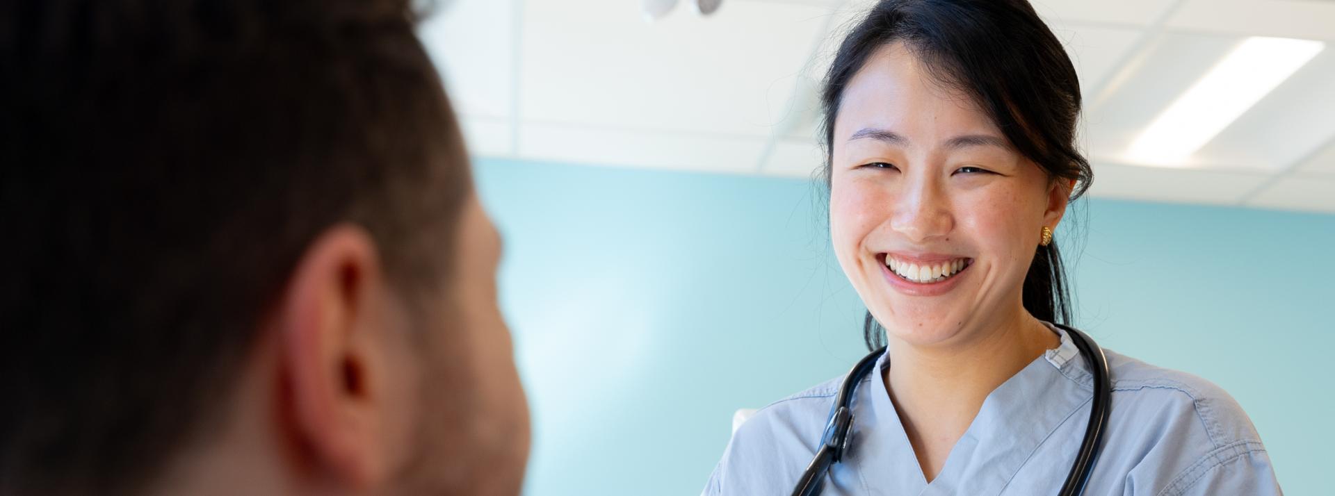 Physician talking with patient at a UPCC