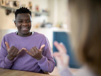 A youth having a conversation in sign language