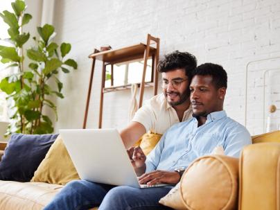 Couple looking at laptop together