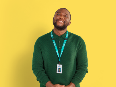 Photo of Oluwaseun, Corporate Communications against a yellow background