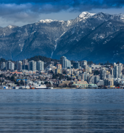 North Vancouver mountains against city skyline and water
